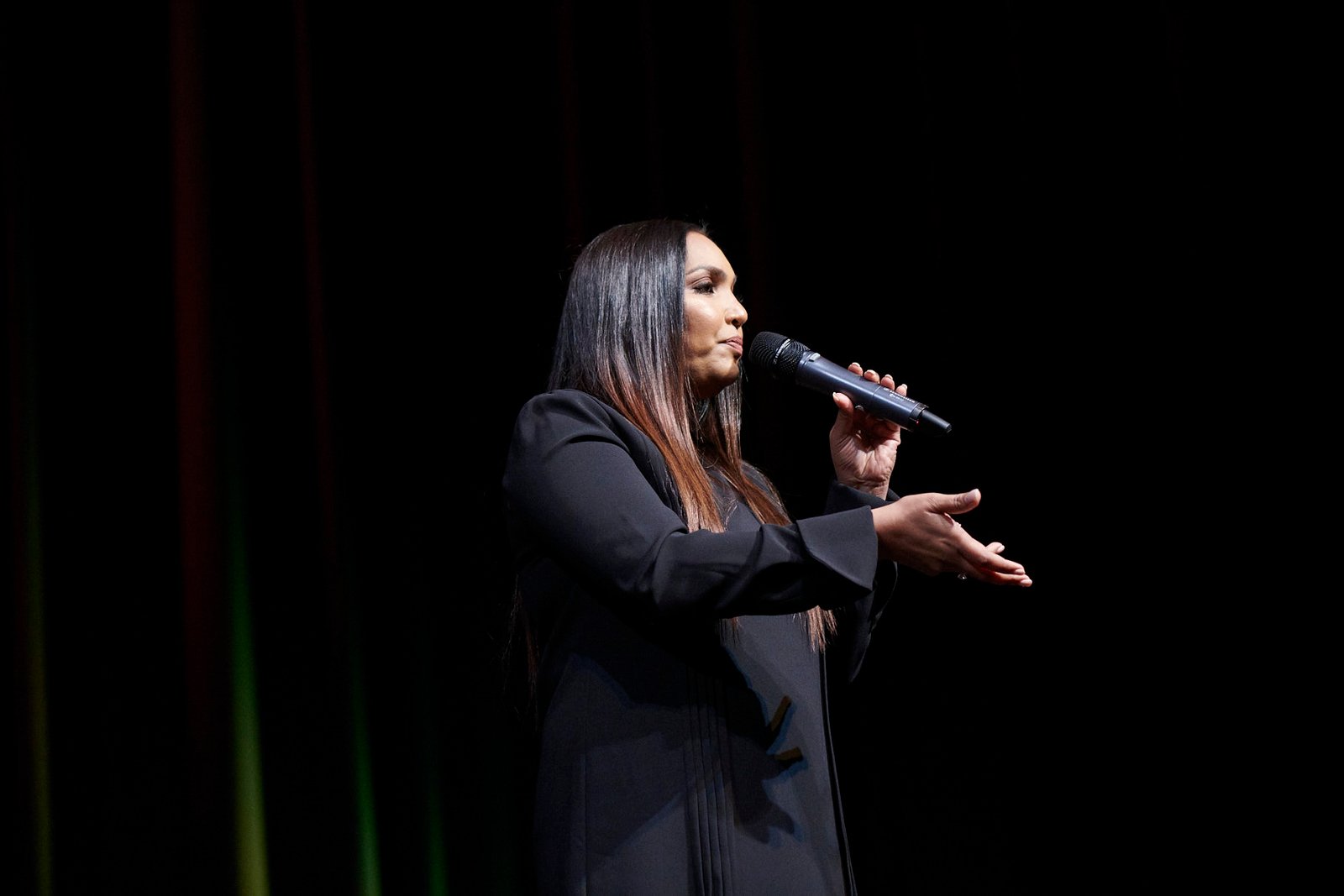 Norliza speaking on stage