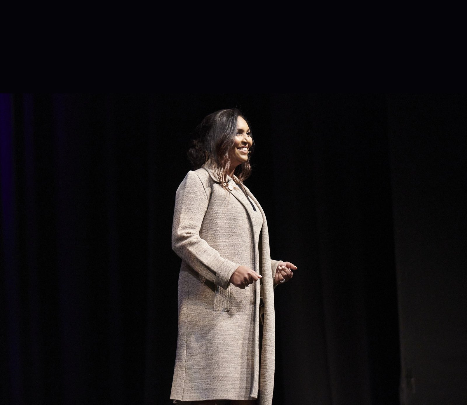 Norliza Pavlakos speaking on stage