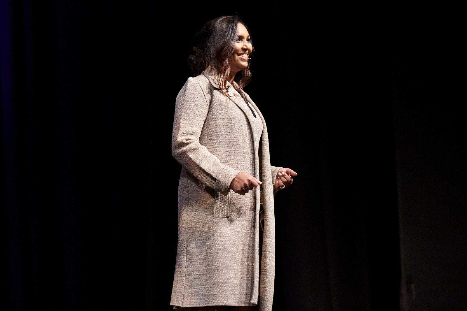 Norliza speaking on stage