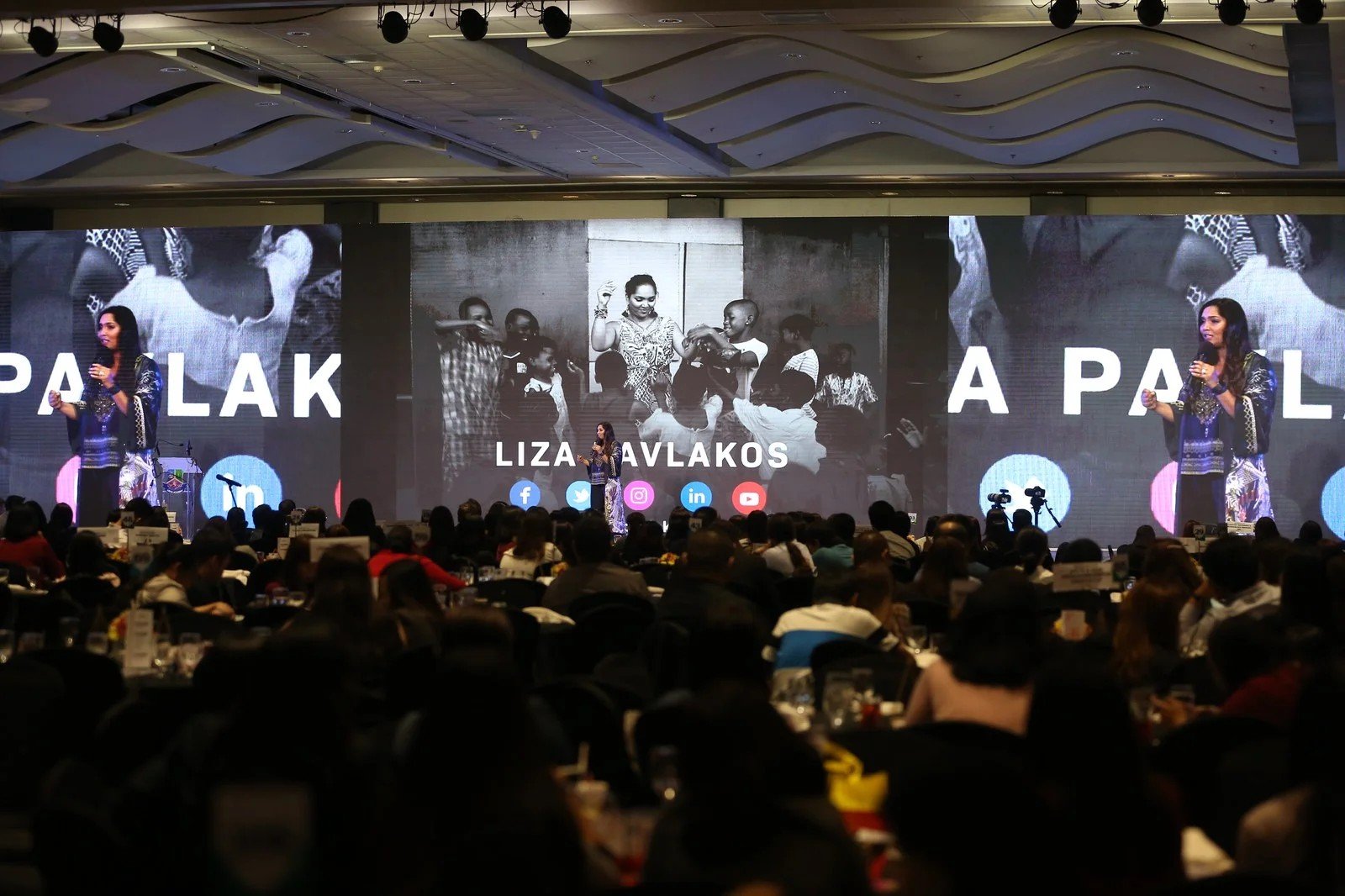 Norliza speaking on stage